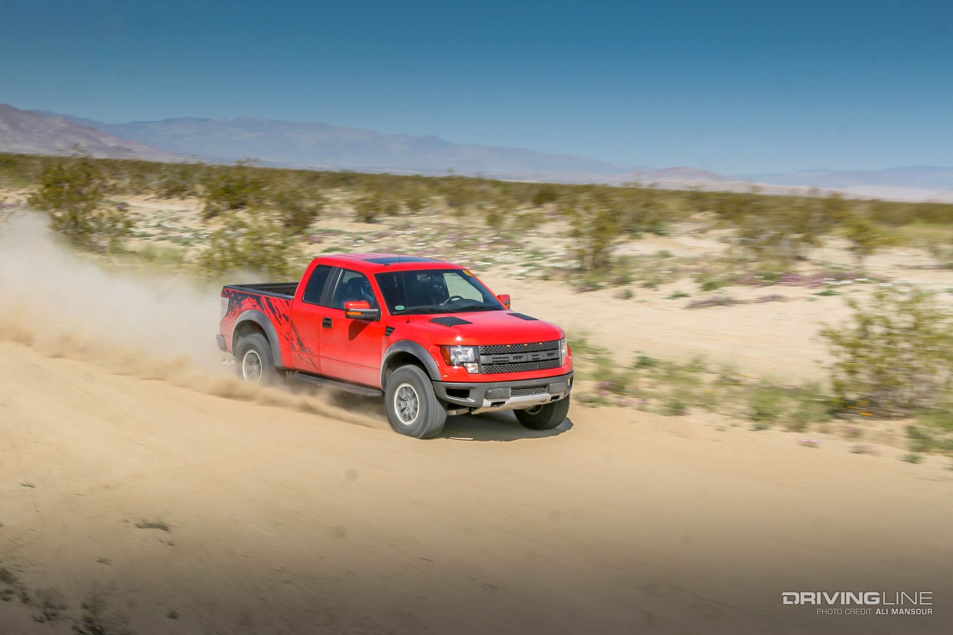 red Ford Raptor in action