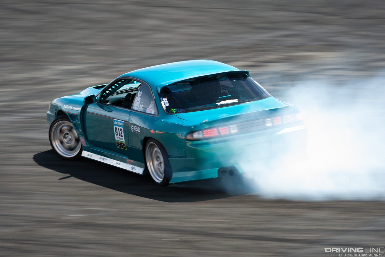 Top Drift round 1 SoCal pro-am drifting Meliton Villamor S14 Nissan 240SX drifting rear shot