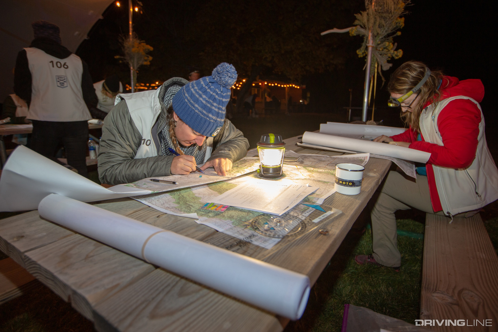 Elise Bent and other Rebelles plotting checkpoints on topo maps