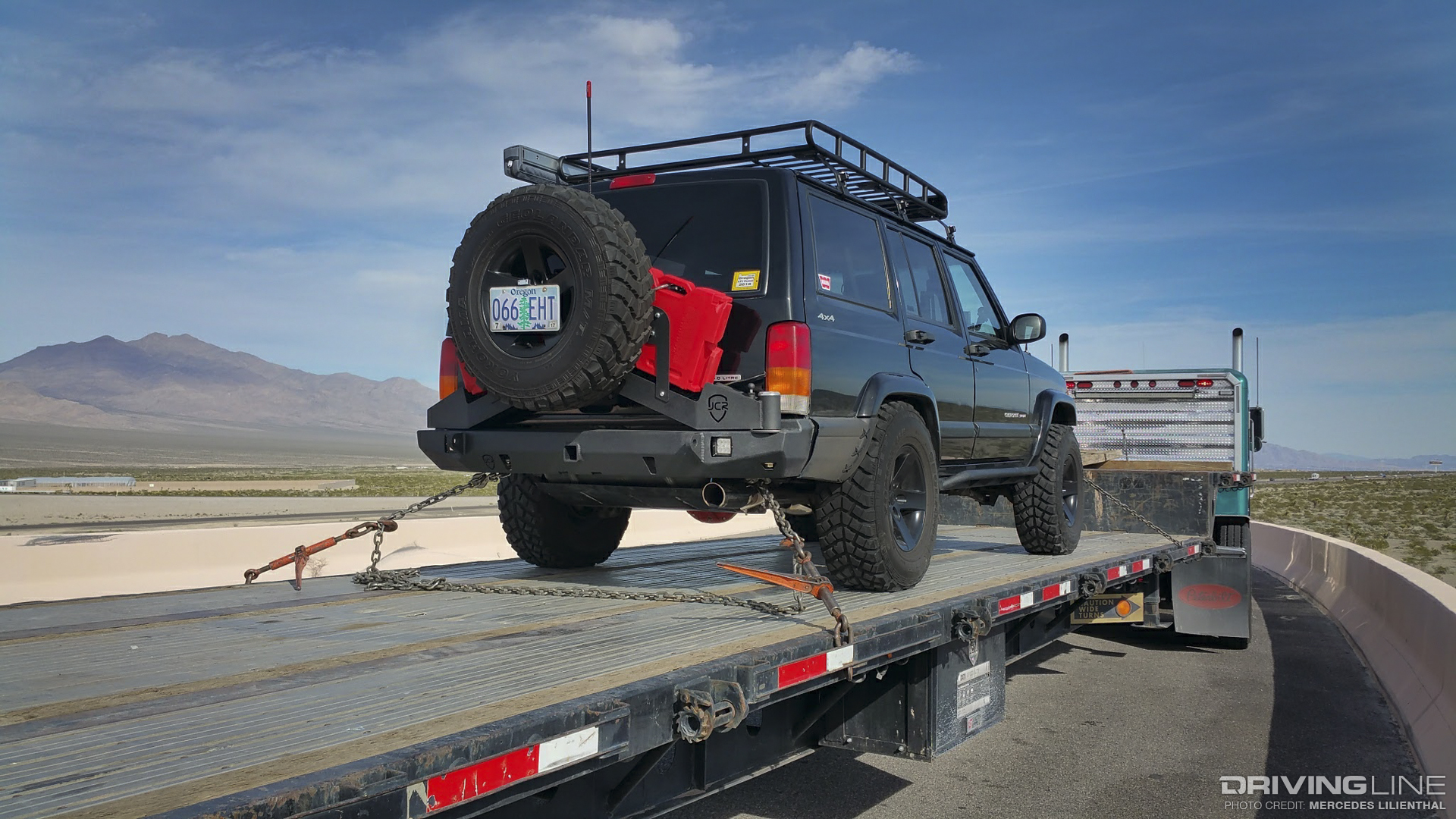 Jeep Cherokee loaded up on semi-truck flatbed