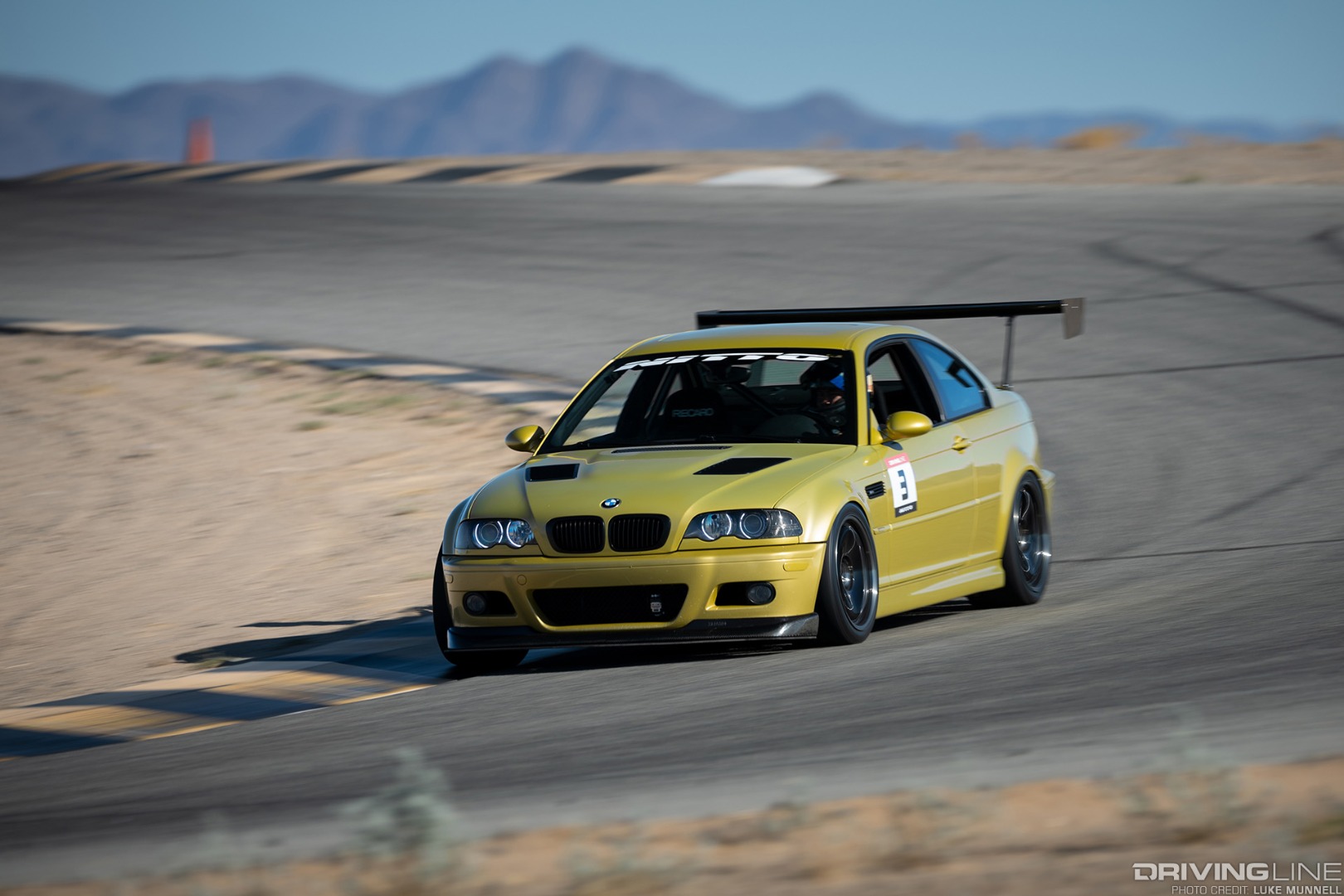 2002 BMW E46 M3 racing on a track