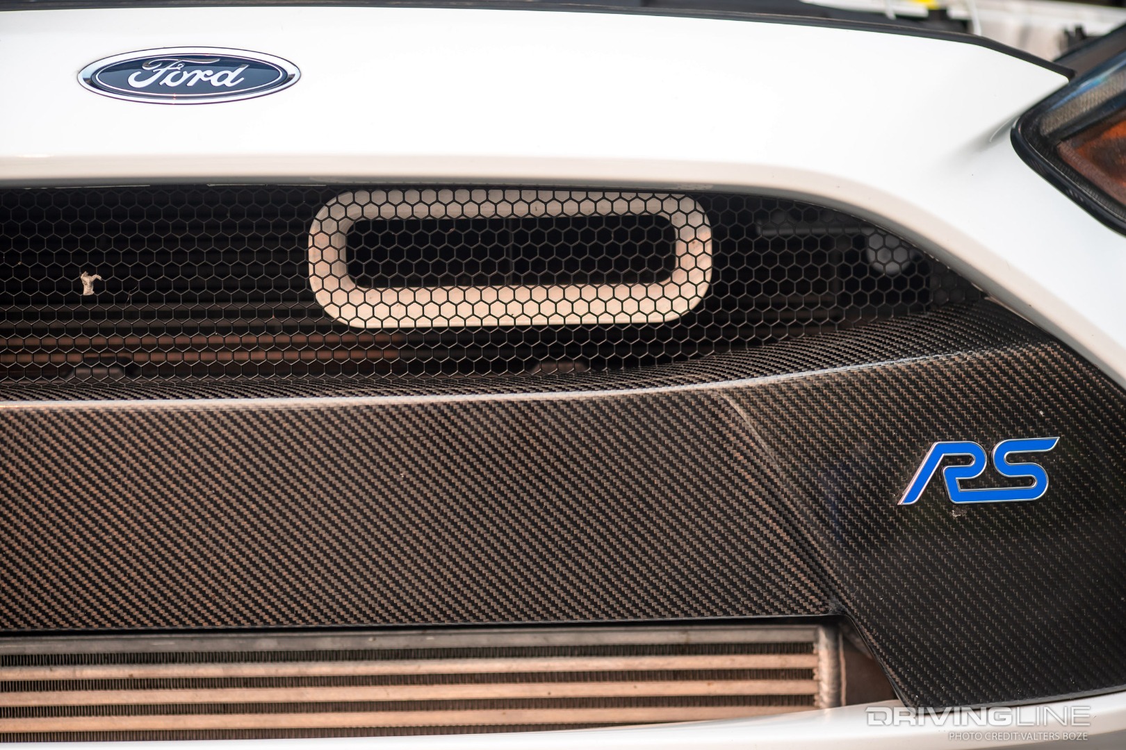 Shortly after buying the car, the modifications started on Jack's Ford Focus RS. The Velossa Big Mouth intake peaks through the Anderson Composites Carbon Fiber grill