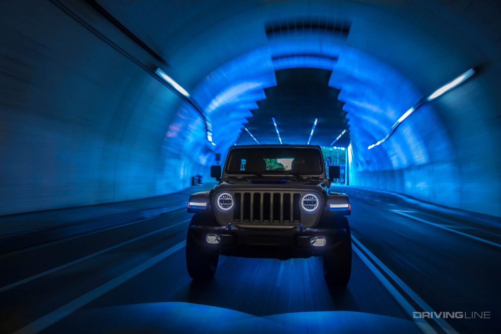 2021 jeep wrangler 4xe driving in a tunnel