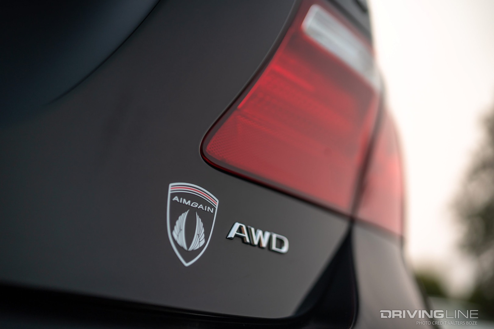 An AIMGAIN badge alerts bystanders to the styling cues on Lawrence Ojas's Lexus LS460L