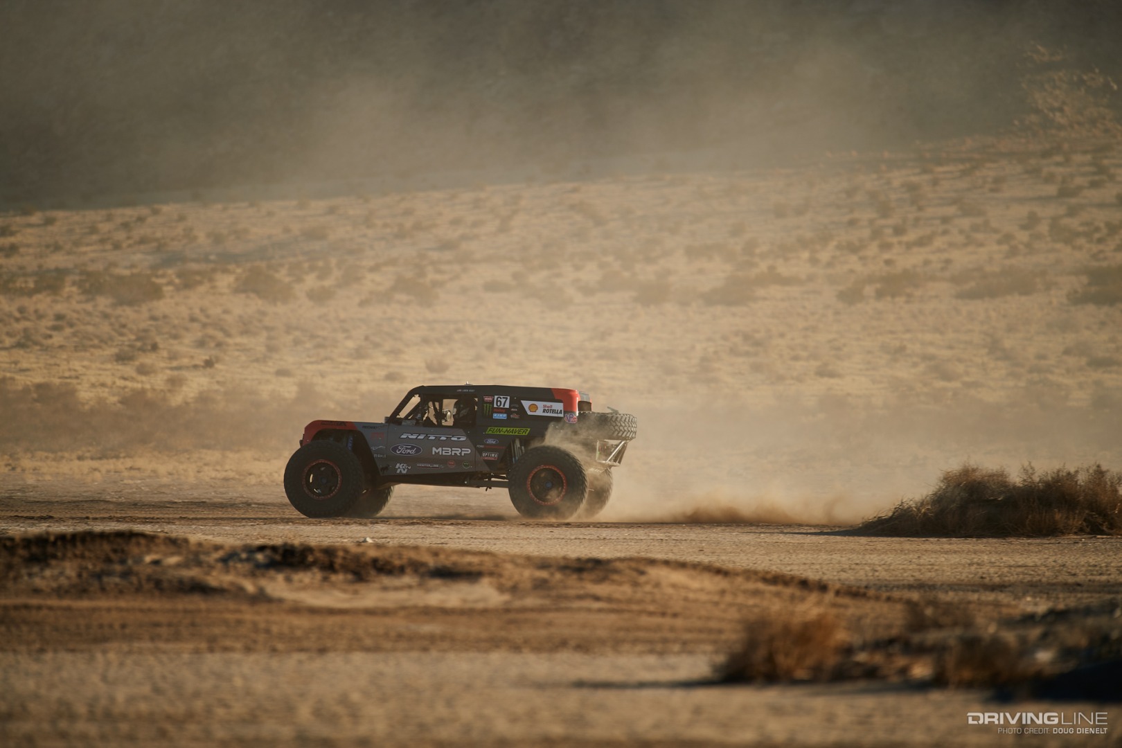 Loren Healy driving fast through the desert