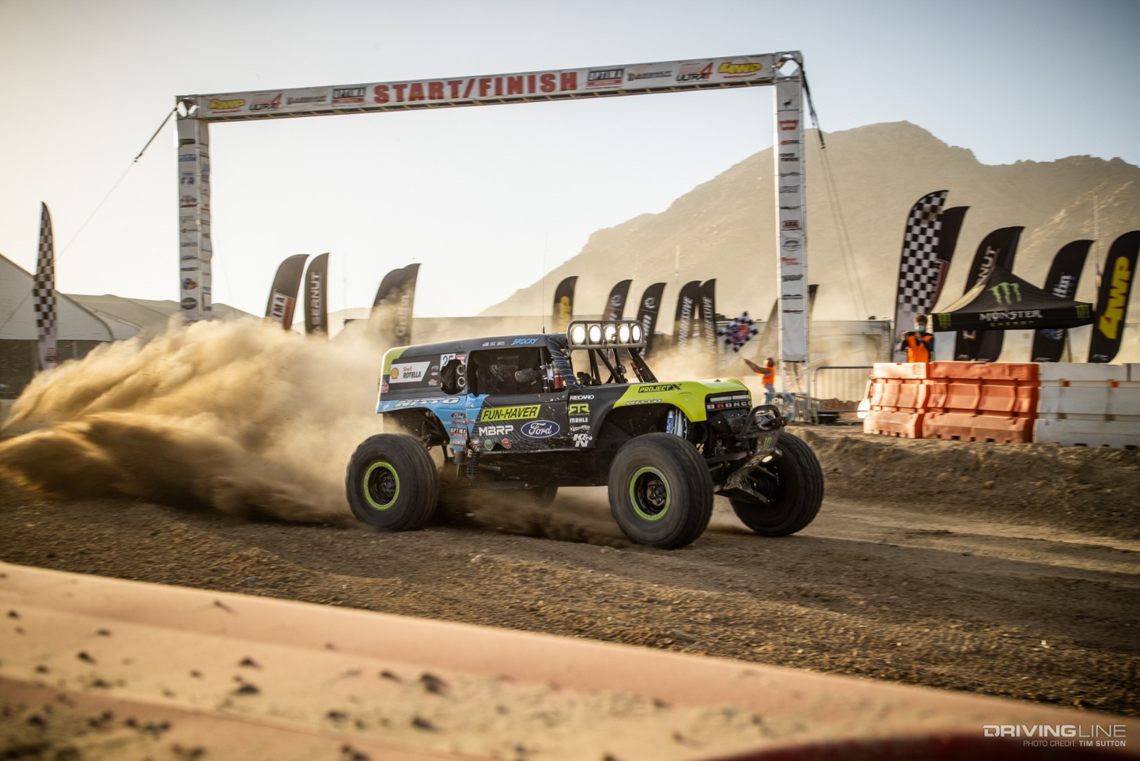Vaughn Gittin Jr. driving across the finish line
