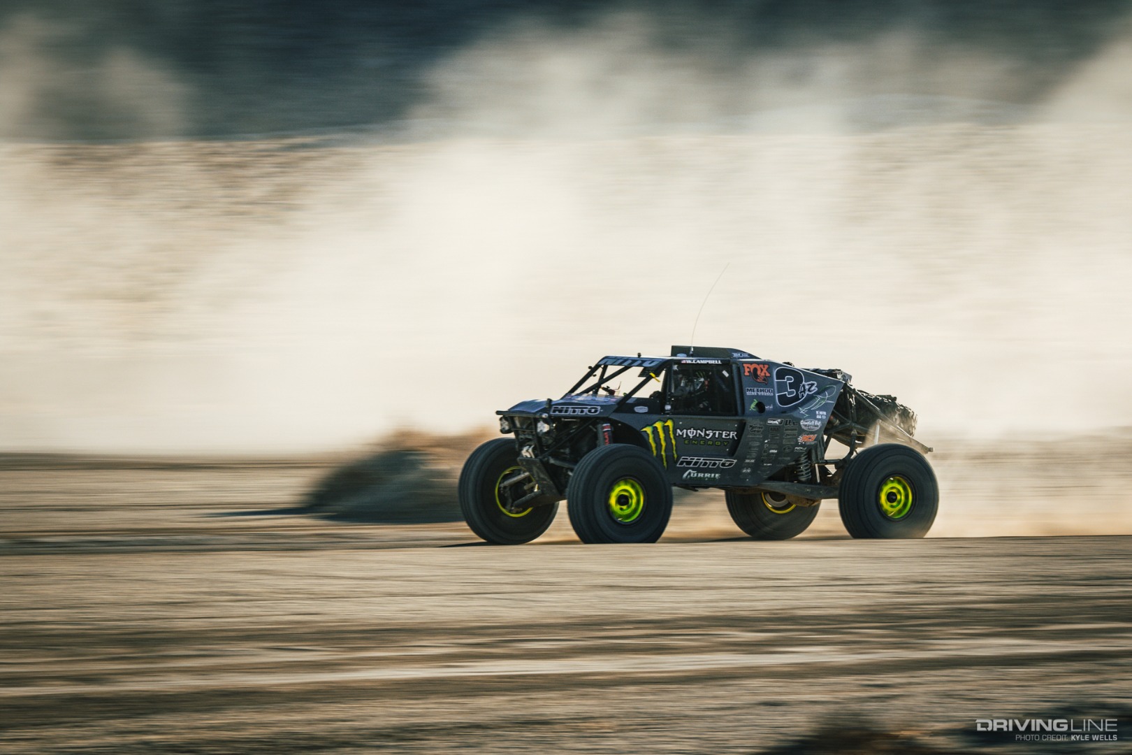 Wayland Campbell driving fast through the desert