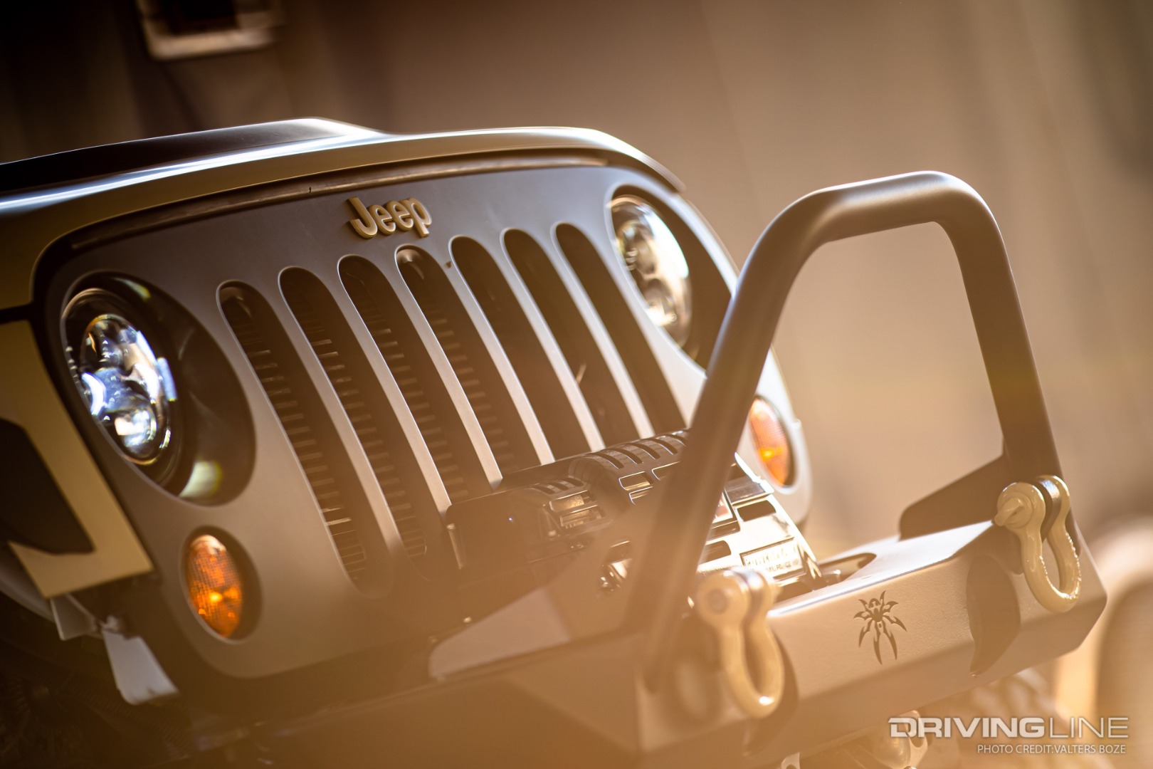 The Smittybuilt front bumper now holds a WARN winch on this HEMI-powered Jeep Wrangler