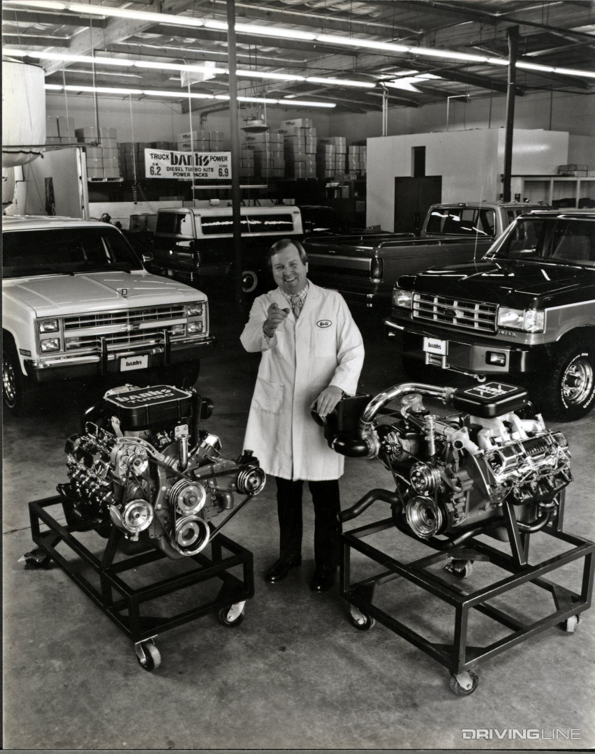 Old photo of Gale Banks with engines and trucks