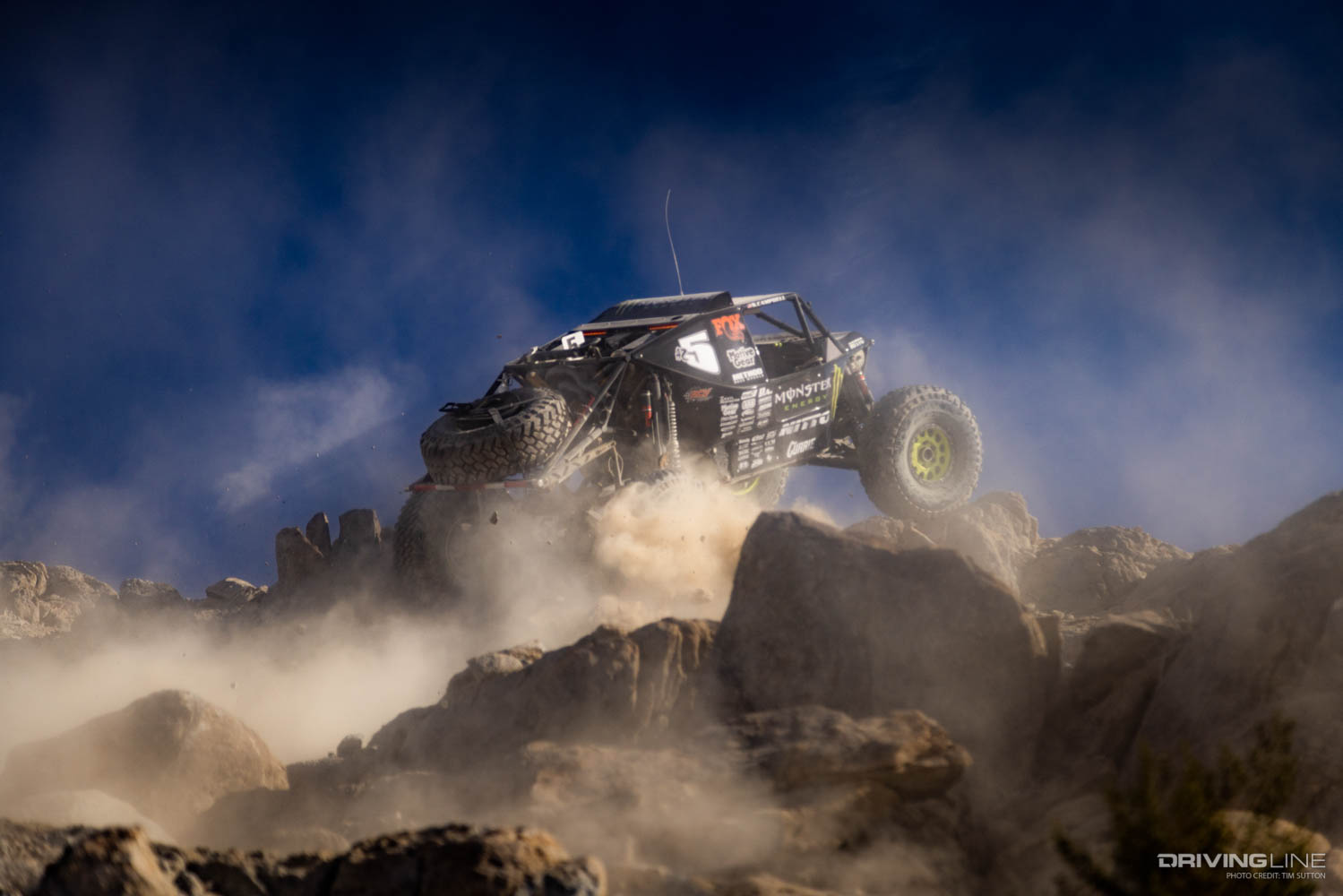 Shannon Campbell cresting a hill racing on Nitto Trail Grappler tires