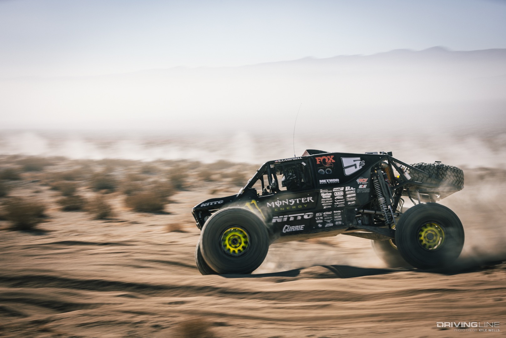 Shannon Campbell driving through the desert