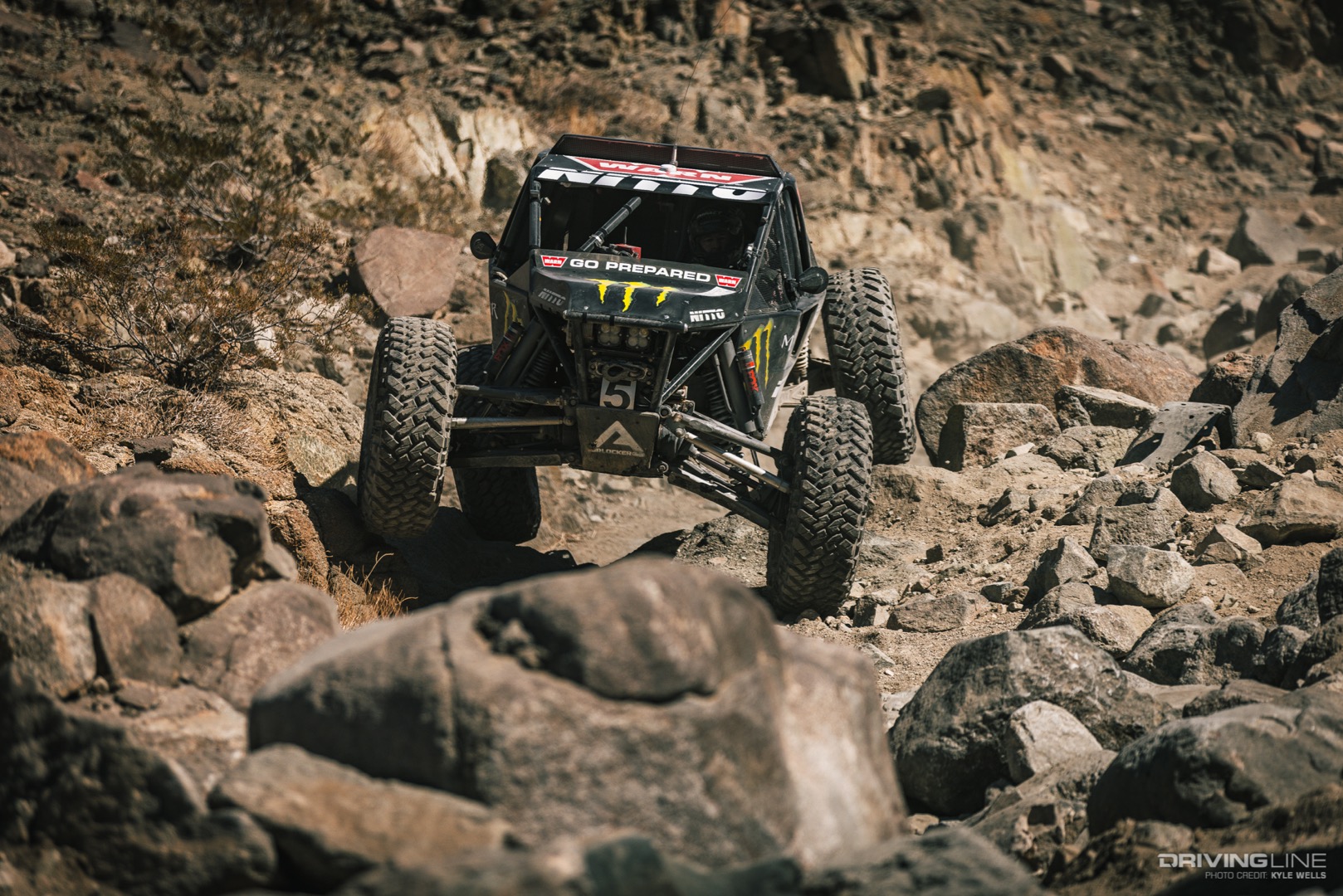 Shannon Campbell driving down a rock trail