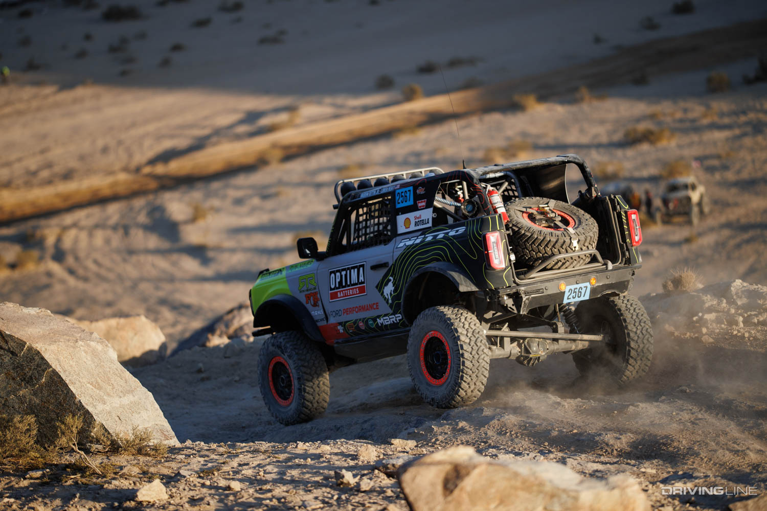 Vaughn Gittin Jr. and Loren Healy off-road racing together in a stock class bronco