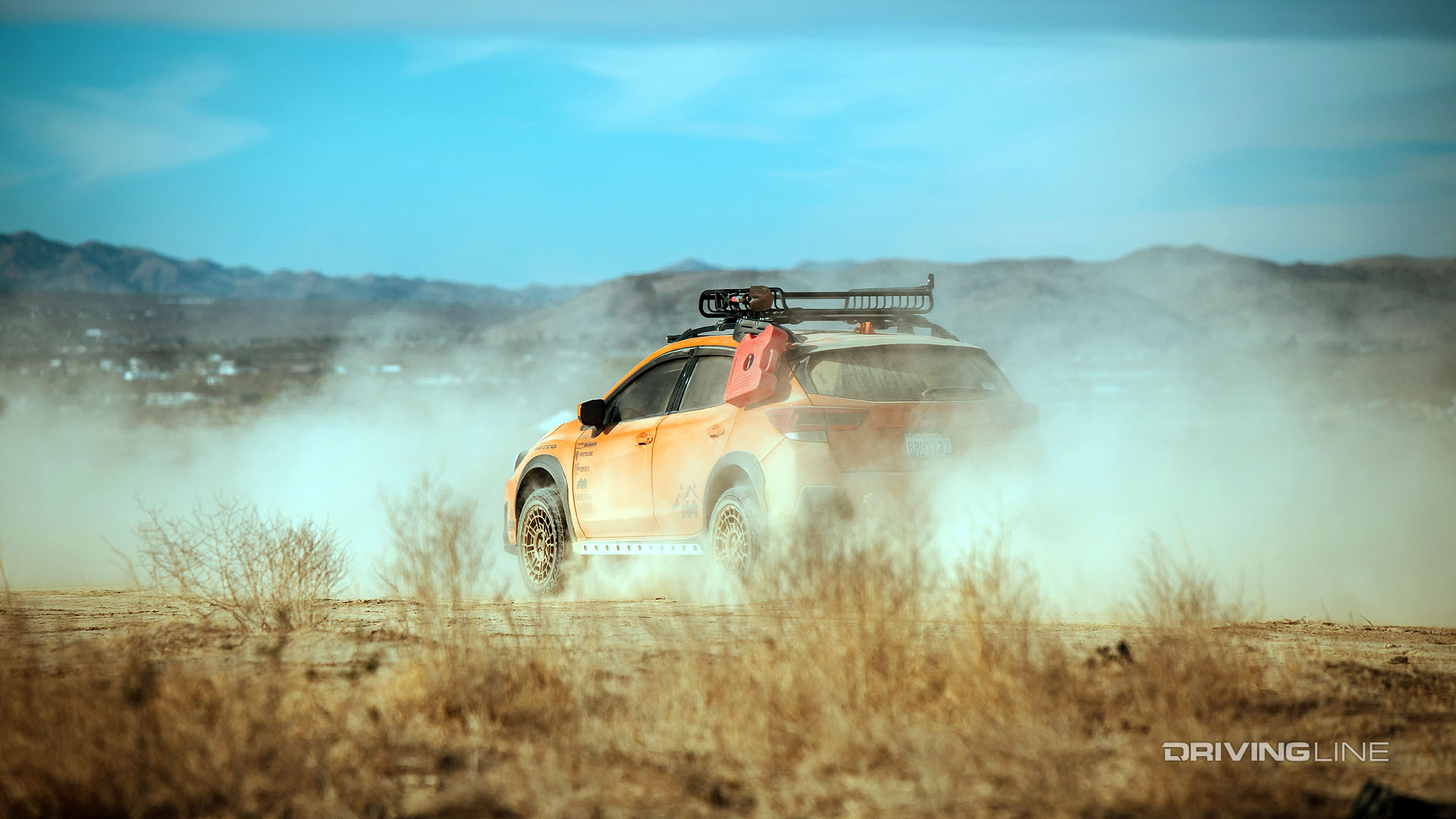 subaru crosstrek racing through the desert
