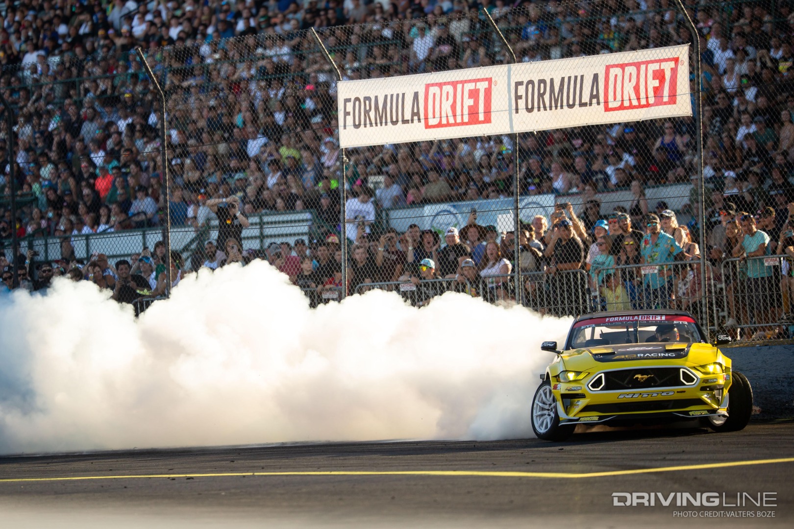 Chelsea DeNofa's RTR Mustang competing in Formula Drift illustrating negative camber suspension tuning