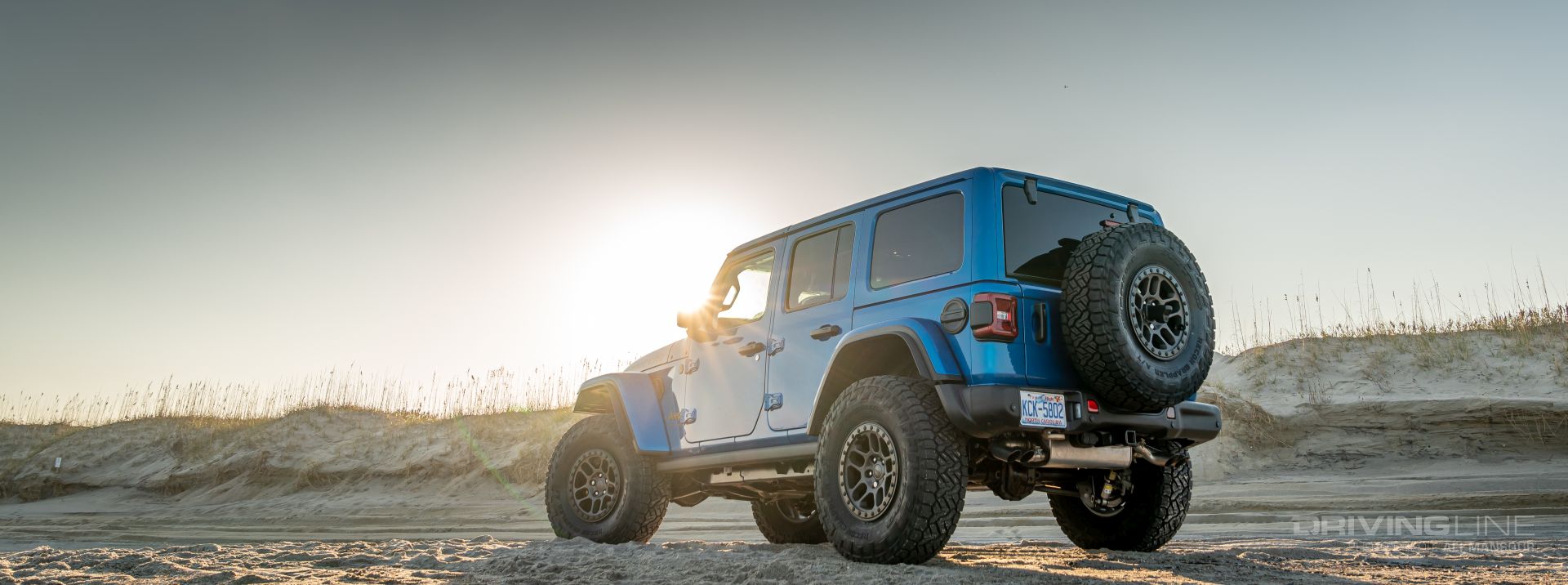 2023 Jeep Wrangler Rubicon XR392 37s REcon Grapplers at sunset on a beach