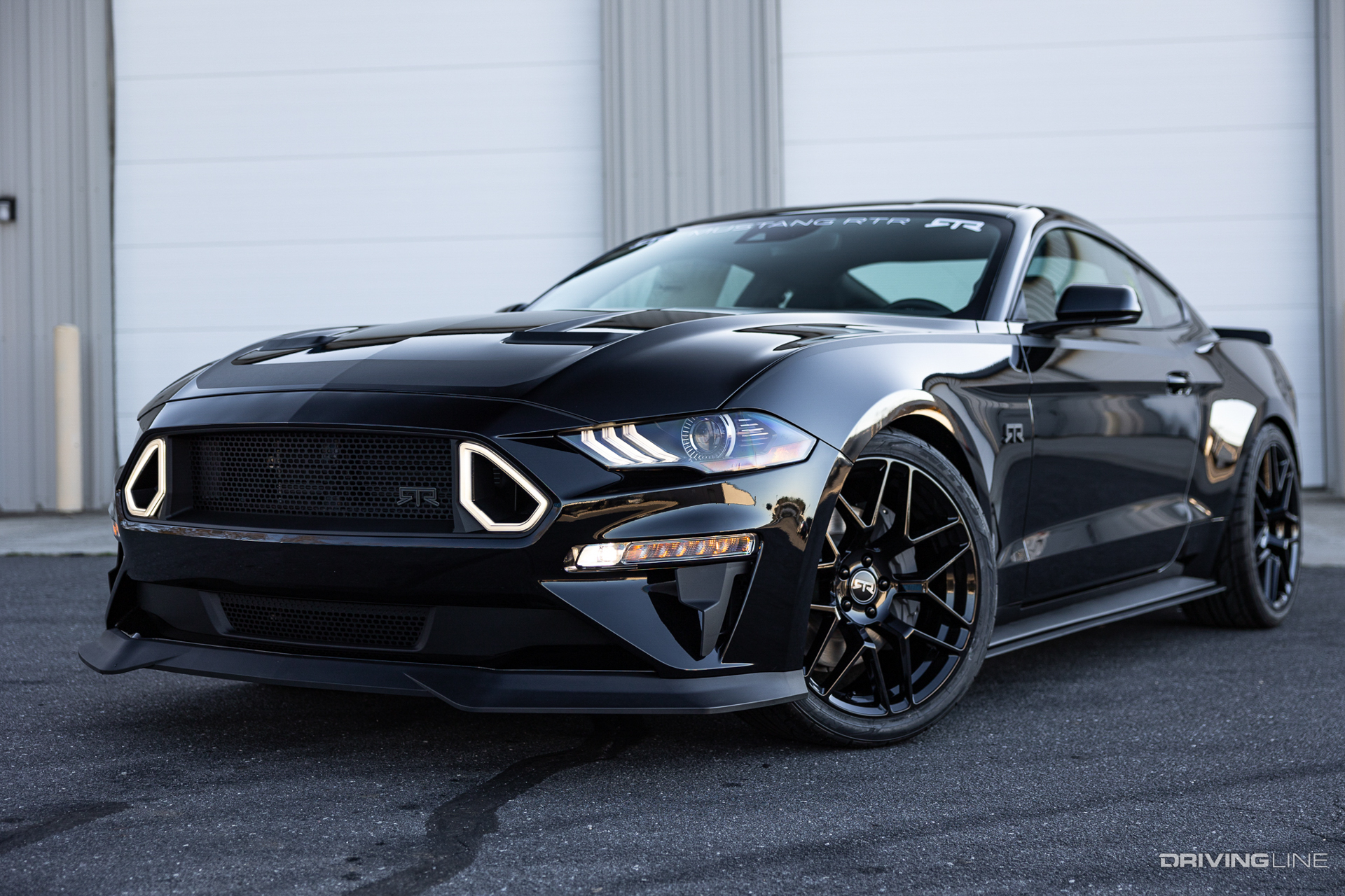 The Spec 2 package adds a front chin spoiler, some additional side rocker and rear quarter splitters and RTR heat extractor hood vents to add to the overall look