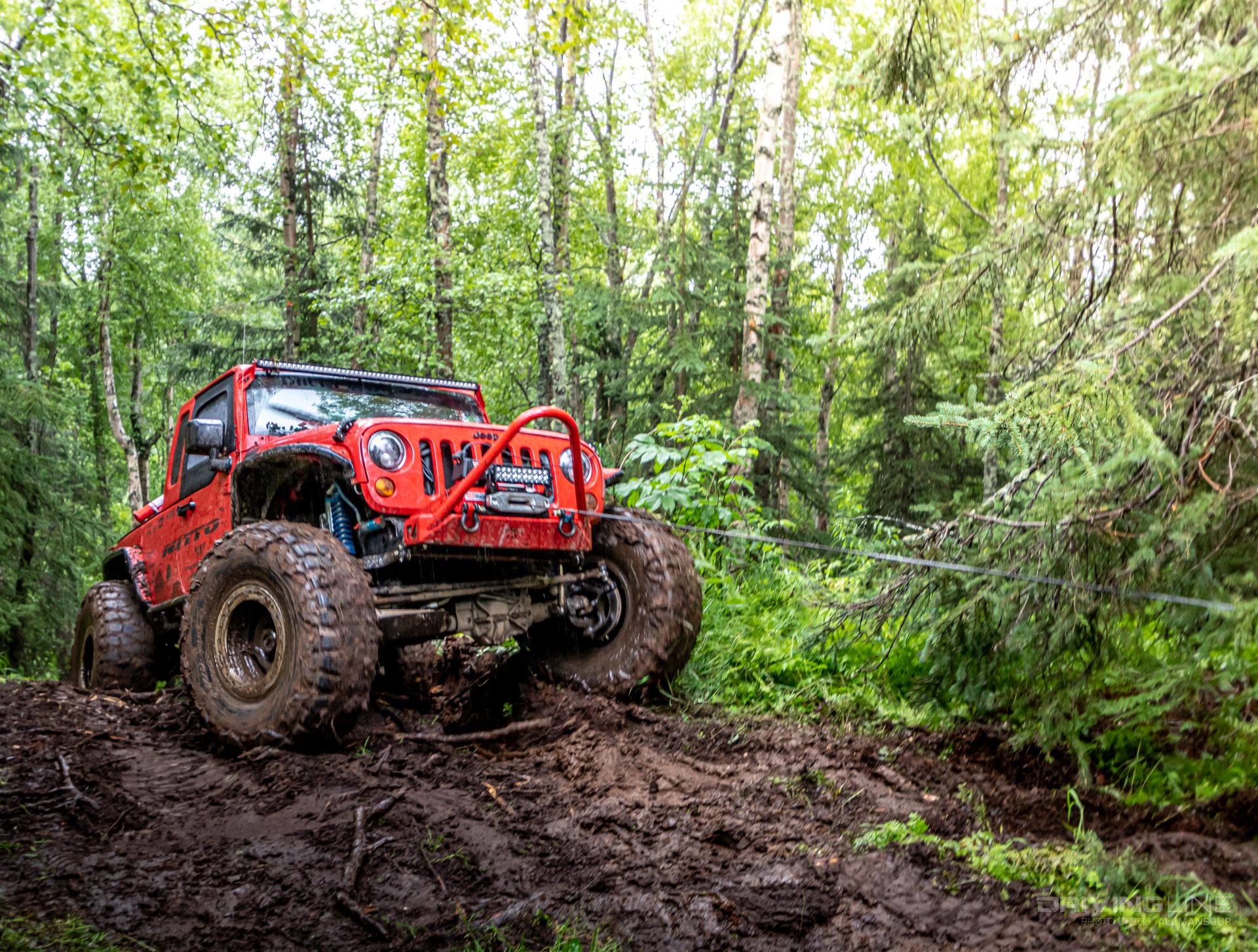 Jeep winching in mud