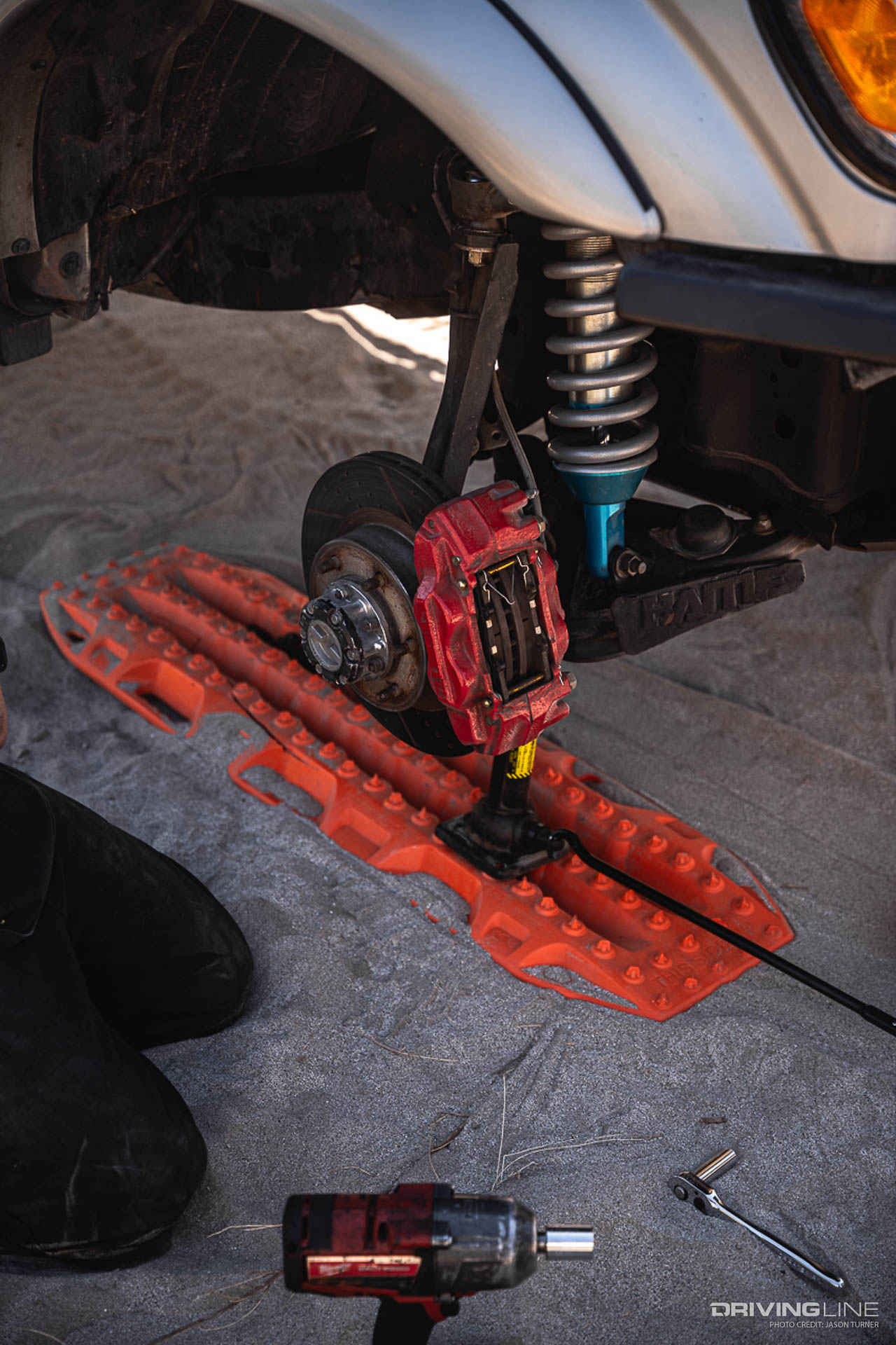 Toyota Tacoma exposed wheel hub and brake caliper on a Jack