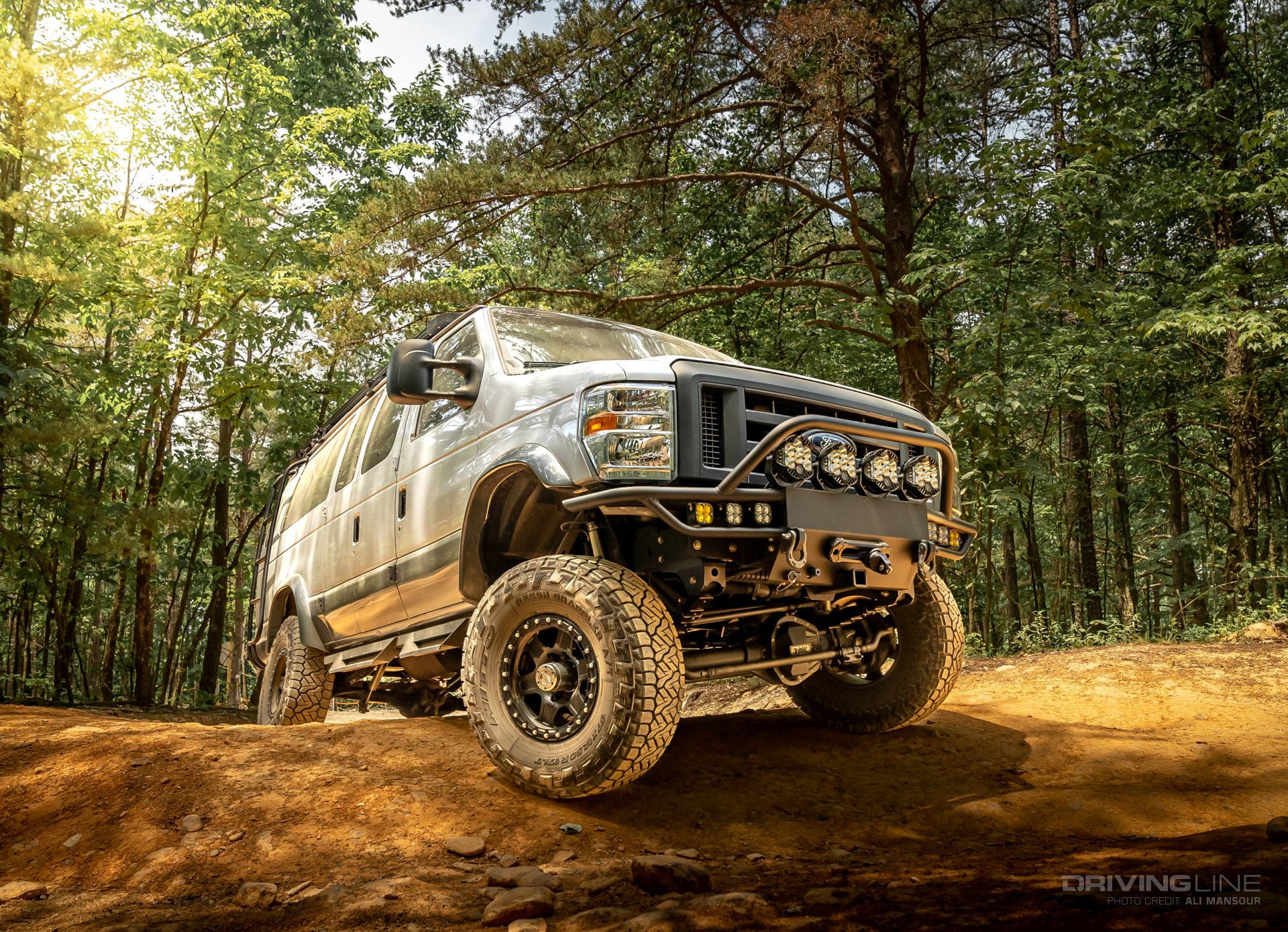 2014 Ford E350 4x4 van 37s Nitto Recon Grapplers front view