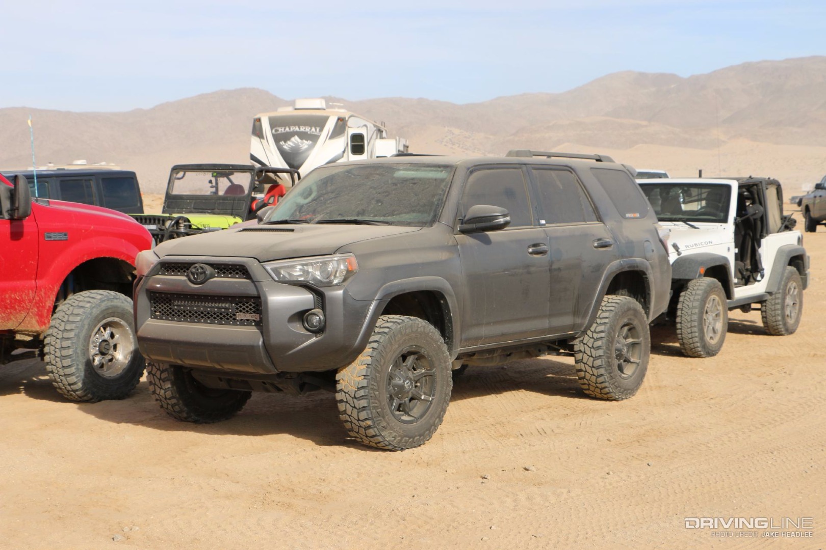 Black 4Runner covered in dust and parked off-road
