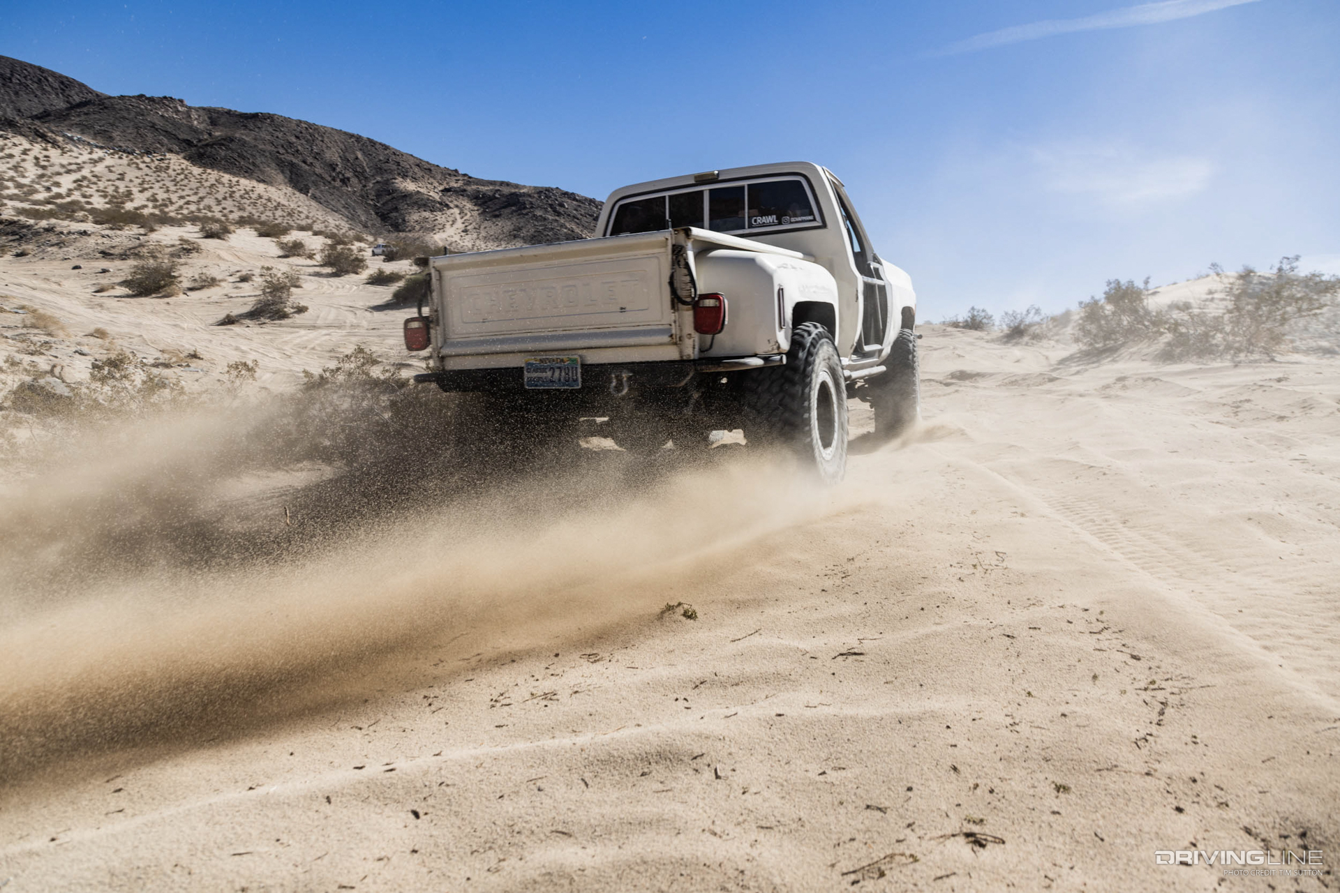 Rear end of lifted Chevy K!0 Square Body truck on Nitto 40 inch Trail Grappler tires