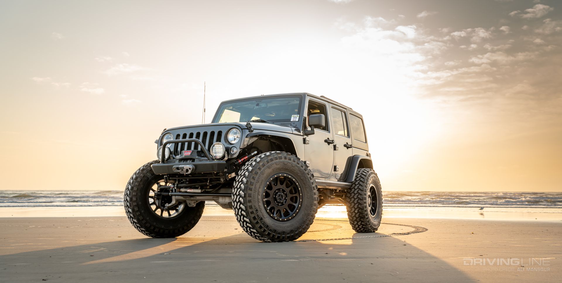 2016 Jeep Wrangler JK on 42s front 3/4 view Daytona Beach Sunrise
