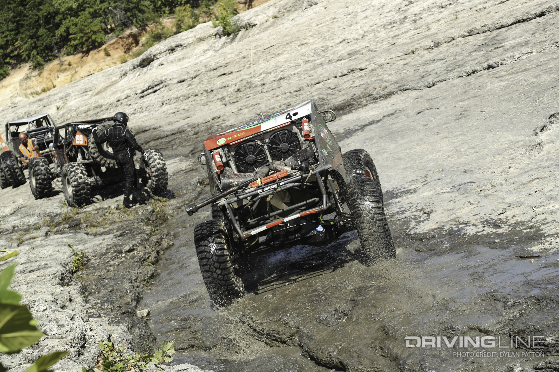Watching car after car slowly claimed by the rough rock