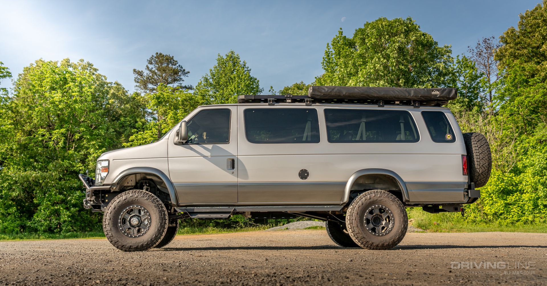 2014 Ford E350 4x4 van on 37s side view